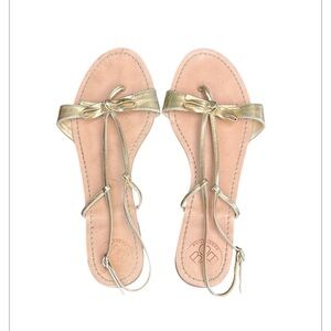 BCBGeneration Women's Bow Gold Metallic Strappy Flat Sandal